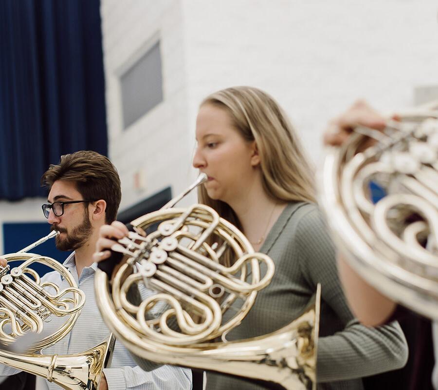students from the music education program playing the french horn
